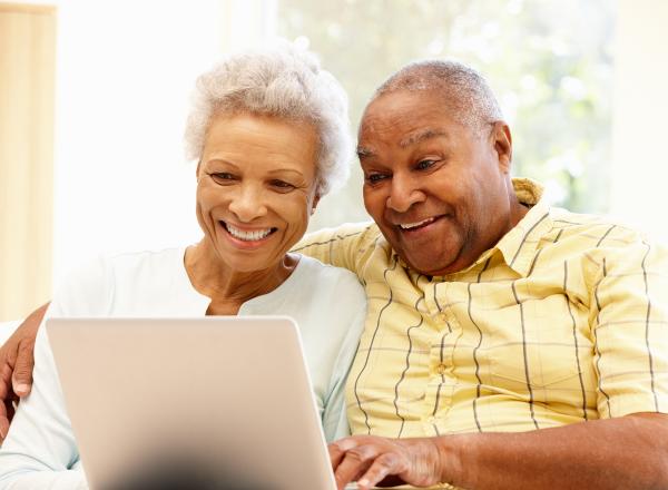 Older couple using laptop together