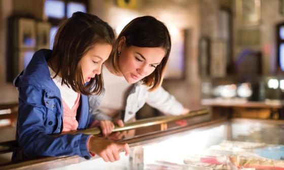 Mom and daughter looking at display