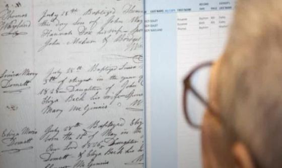 Person with glasses looking at documents