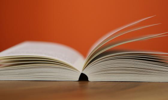 Open book lying on table