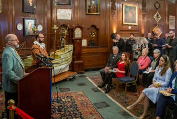 Brenton Simons giving a press conference