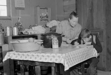 The youngest Wardlow boy copies out a recipe for his mother. Courtesy of the Library of Congress