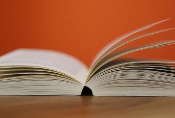 Open book lying on table