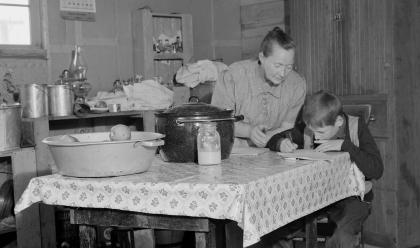 The youngest Wardlow boy copies out a recipe for his mother. Courtesy of the Library of Congress
