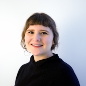 Image of Sarah Quiat, wearing black shirt with hair back.