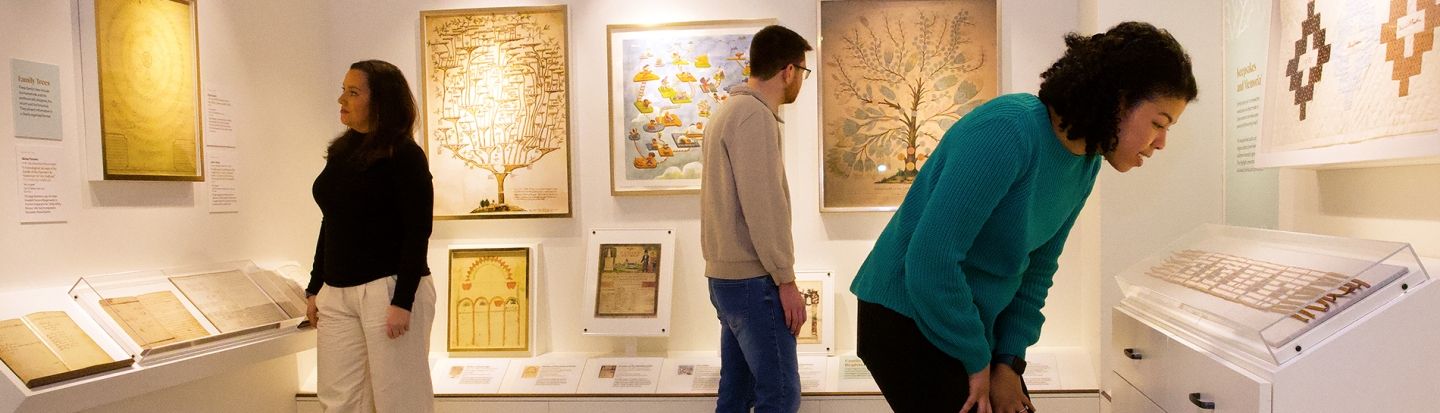 Family Heritage Tour visitors viewing an exhibit
