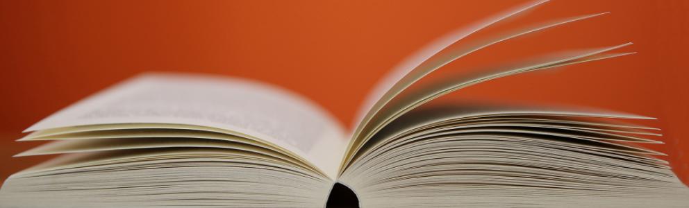 Open book lying on table