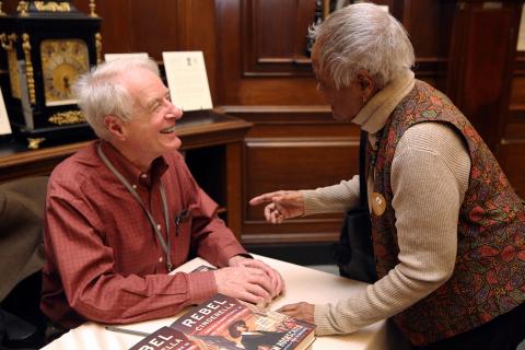 Adam Hochschild laughs with audience member