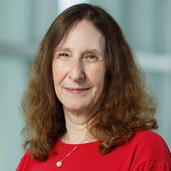 Headshot of Ellen Smith Image of Ellen Smith wearing a red shirt, looking at the camera.