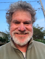 Selfie of Stephen Weiner outdoors in a quarter-zip sweater