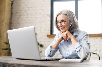 event-building-your-genealogical-skills-1-2022.jpg Researcher uses laptop at home