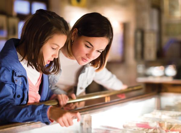 Mom and daughter looking at display