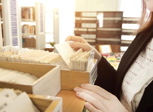 Librarian looking at index cards