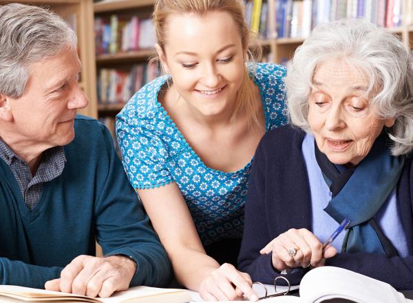 Students and teacher in a library