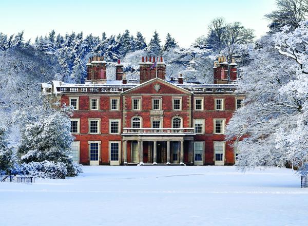 English country house in snow