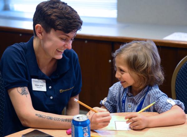 An image of an American Ancestors staff expert teaching a kid family history