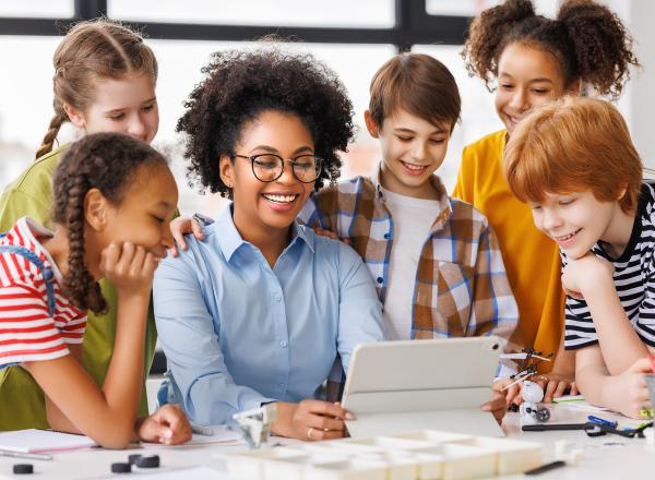 Students gathered around a computer