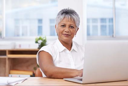 woman with short hair on laptop