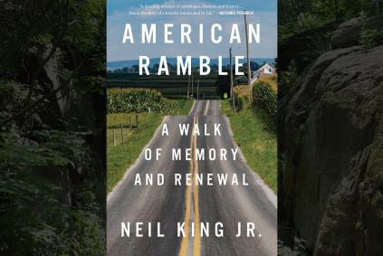 Neil King with American Ramble book cover with background of a road