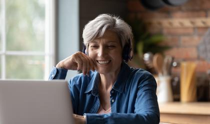 Woman learning What’s New at American Ancestors woman on laptop at home