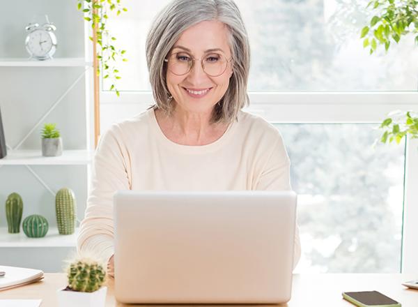 Woman smiling at laptop